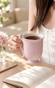 Fuyu Butterfly Bud Mug — Blush Pink — styled use illustration; props and additional pieces excluded 10; AI-assisted image
