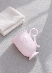 Fuyu Butterfly Bud Mug — Blush Pink — styled use illustration; props and additional pieces excluded 11; AI-assisted image