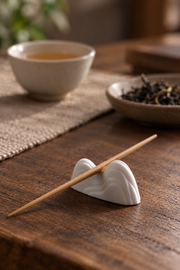 PUSU Mountain Porcelain Chopstick Rest — styled use illustration; props and additional pieces excluded 9; AI-assisted image