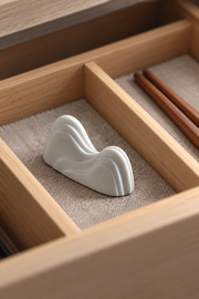 PUSU Mountain Porcelain Chopstick Rest — styled use illustration; props and additional pieces excluded 11; AI-assisted image
