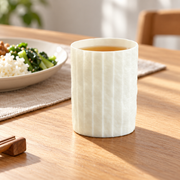 Shiwu Wanyi Folded Porcelain Tumbler — styled use illustration; props and additional pieces excluded 8; AI-assisted image