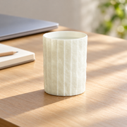 Shiwu Wanyi Folded Porcelain Tumbler — styled use illustration; props and additional pieces excluded 9; AI-assisted image