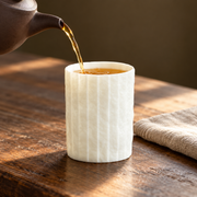 Shiwu Wanyi Folded Porcelain Tumbler — styled use illustration; props and additional pieces excluded 10; AI-assisted image