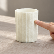 Shiwu Wanyi Folded Porcelain Tumbler — styled use illustration; props and additional pieces excluded 11; AI-assisted image