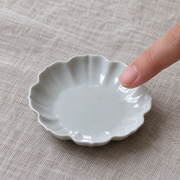 Yuanwu Petal Cup Rest — styled use illustration; props and additional pieces excluded 10; AI-assisted image