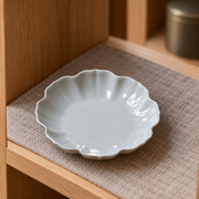 Yuanwu Petal Cup Rest — styled use illustration; props and additional pieces excluded 12; AI-assisted image