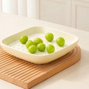 Cream Square Dish with Draining Insert — styled use illustration; props and additional pieces excluded 8; AI-assisted image