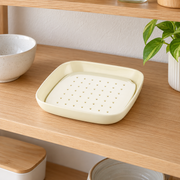 Cream Square Dish with Draining Insert — styled use illustration; props and additional pieces excluded 12; AI-assisted image