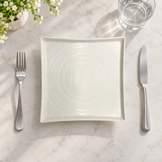 DXC Crystal White Square Plate — styled use illustration; props and additional pieces excluded 8; AI-assisted image