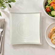 DXC Crystal White Square Plate — styled use illustration; props and additional pieces excluded 11; AI-assisted image