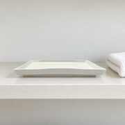 DXC Crystal White Square Plate — styled use illustration; props and additional pieces excluded 12; AI-assisted image