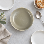 DXC Mist Gray Deep Serving Plate — styled use illustration; props and additional pieces excluded 9; AI-assisted image