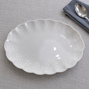 Scalloped White Bone China Oval Platter — styled use illustration; props and additional pieces excluded 7; AI-assisted image