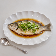 Scalloped White Bone China Oval Platter — styled use illustration; props and additional pieces excluded 8; AI-assisted image