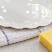 Scalloped White Bone China Oval Platter — styled use illustration; props and additional pieces excluded 12; AI-assisted image