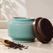 Shang Tang Celadon Tea Canister — styled use illustration; props and additional pieces excluded 7; AI-assisted image
