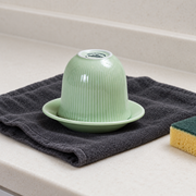 Loveramics Green Tasting Cup & Saucer — styled use illustration; props and additional pieces excluded 11; AI-assisted image