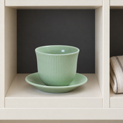 Loveramics Green Tasting Cup & Saucer — styled use illustration; props and additional pieces excluded 12; AI-assisted image