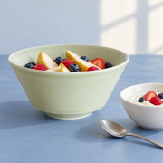 Loveramics Bauhaus Green Serving Bowl — styled use illustration; props and additional pieces excluded 8; AI-assisted image