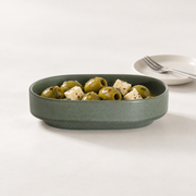 Loveramics Tapas Oval Bowl — Dark Green — styled use illustration; props and additional pieces excluded 7; AI-assisted image
