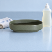 Loveramics Tapas Oval Bowl — Dark Green — styled use illustration; props and additional pieces excluded 11; AI-assisted image