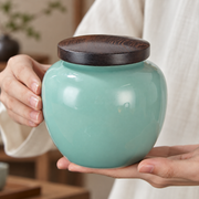 Shang Tang Rounded Celadon Tea Canister — styled use illustration; props and additional pieces excluded 8; AI-assisted image