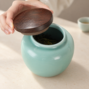 Shang Tang Rounded Celadon Tea Canister — styled use illustration; props and additional pieces excluded 9; AI-assisted image