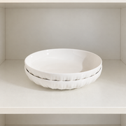 MDZF Fluted White Deep Plates — Pair — styled use illustration; props and additional pieces excluded 11; AI-assisted image