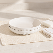 MDZF Fluted White Deep Plates — Pair — styled use illustration; props and additional pieces excluded 12; AI-assisted image