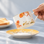 Taoxichuan Koi Cup & Saucer — styled use illustration; props and additional pieces excluded 7; AI-assisted image