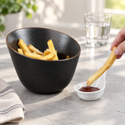 Rollin Black Slanted Bowl — 630 mL — styled use illustration; props and additional pieces excluded 7; AI-assisted image