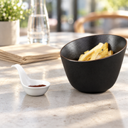 Rollin Black Slanted Bowl — 630 mL — styled use illustration; props and additional pieces excluded 8; AI-assisted image