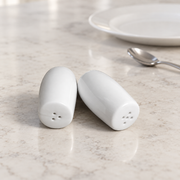 Rollin White Salt & Pepper Shakers — Pair — styled use illustration; props and additional pieces excluded 8; AI-assisted image