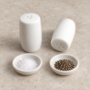 Rollin White Salt & Pepper Shakers — Pair — styled use illustration; props and additional pieces excluded 11; AI-assisted image