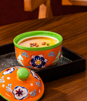 SONGFA Orange Lidded Pot — 400 mL — styled use illustration; props and additional pieces excluded 9; AI-assisted image