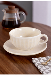SONGFA Oatmeal Fluted Cup & Saucer — styled use illustration; props and additional pieces excluded 8; AI-assisted image