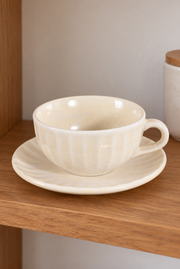 SONGFA Oatmeal Fluted Cup & Saucer — styled use illustration; props and additional pieces excluded 11; AI-assisted image