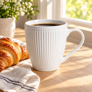 AI-assisted illustration of Pearl White Ribbed Breakfast Mug, window coffee setting; food and styling props are not included.