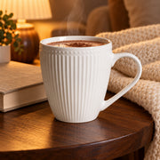 AI-assisted illustration of Pearl White Ribbed Breakfast Mug, cocoa evening setting; food and styling props are not included.