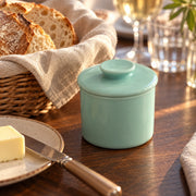 AI-assisted illustration of Mint French Butter Keeper, dinner bread setting; food and styling props are not included.
