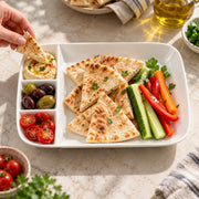 AI-assisted illustration of Ivory Four-Compartment Plate, mediterranean snack setting; food and styling props are not included.