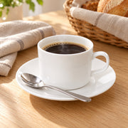 AI-assisted illustration of Ivory Cylinder Cup & Saucer, morning coffee setting; food and styling props are not included.