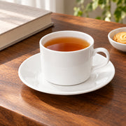 AI-assisted illustration of Ivory Cylinder Cup & Saucer, afternoon tea setting; food and styling props are not included.