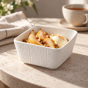 AI-assisted illustration of White Textured Square Bowl, fruit dessert setting; food and styling props are not included.