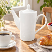 AI-assisted illustration of Ivory Lidded Coffee Pot, breakfast table setting; food and styling props are not included.
