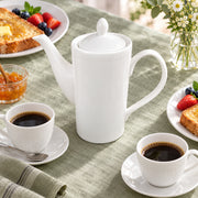 AI-assisted illustration of Ivory Lidded Coffee Pot, weekend brunch setting; food and styling props are not included.