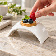 AI-assisted illustration of Ivory Arch Appetizer Dish, berry dessert setting; food and styling props are not included.