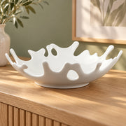 AI-assisted illustration of Coral-Rim White Serving Bowl, empty console setting; food and styling props are not included.