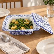 AI-assisted concept image of cobalt botanical lidded server: styled table view; food and props are not included.