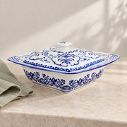 AI-assisted concept image of cobalt botanical lidded server: styled editorial view; food and props are not included.